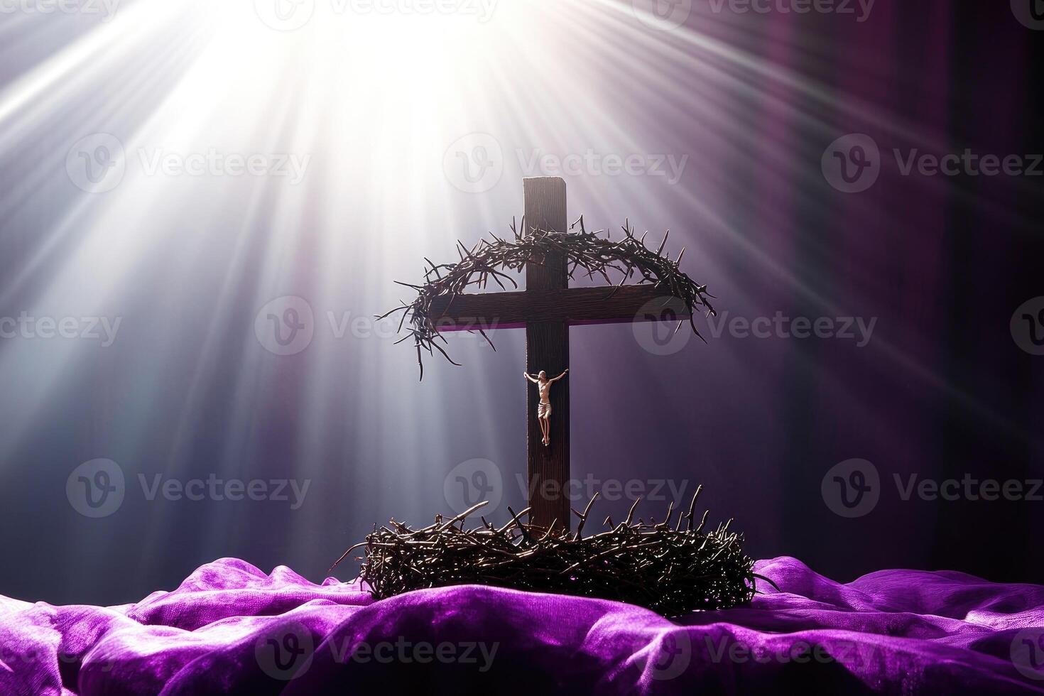 Crucifix with crown of thorns surrounded by purple flowers photo