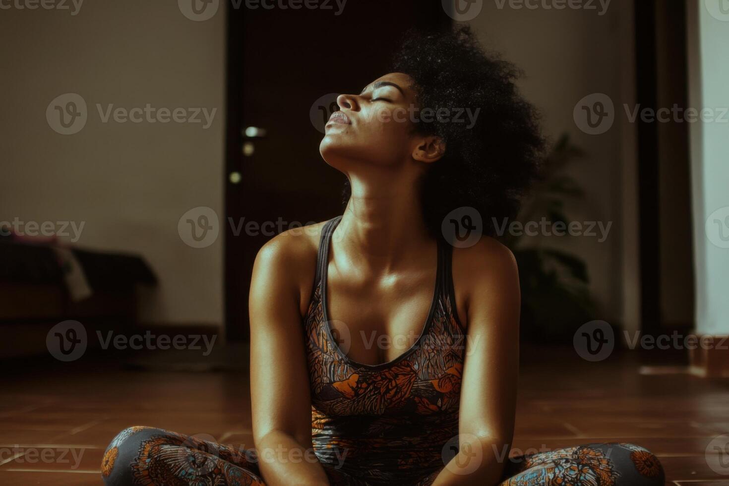 Young woman practices mindfulness and relaxation in a serene indoor setting with natural lighting and a relaxed posture photo
