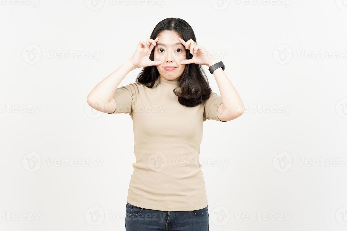 Asian woman making a heart shape with her hands photo
