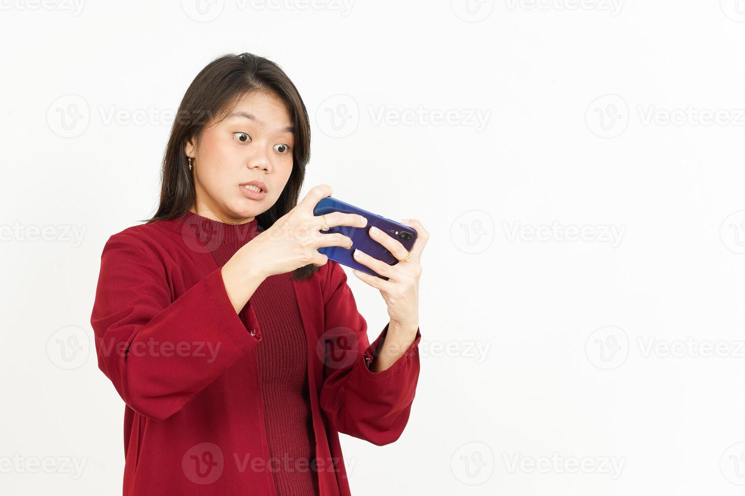 Playing Mobile Game on Smartphone Of Beautiful Asian Woman Wearing Red Shirt Isolated On White photo
