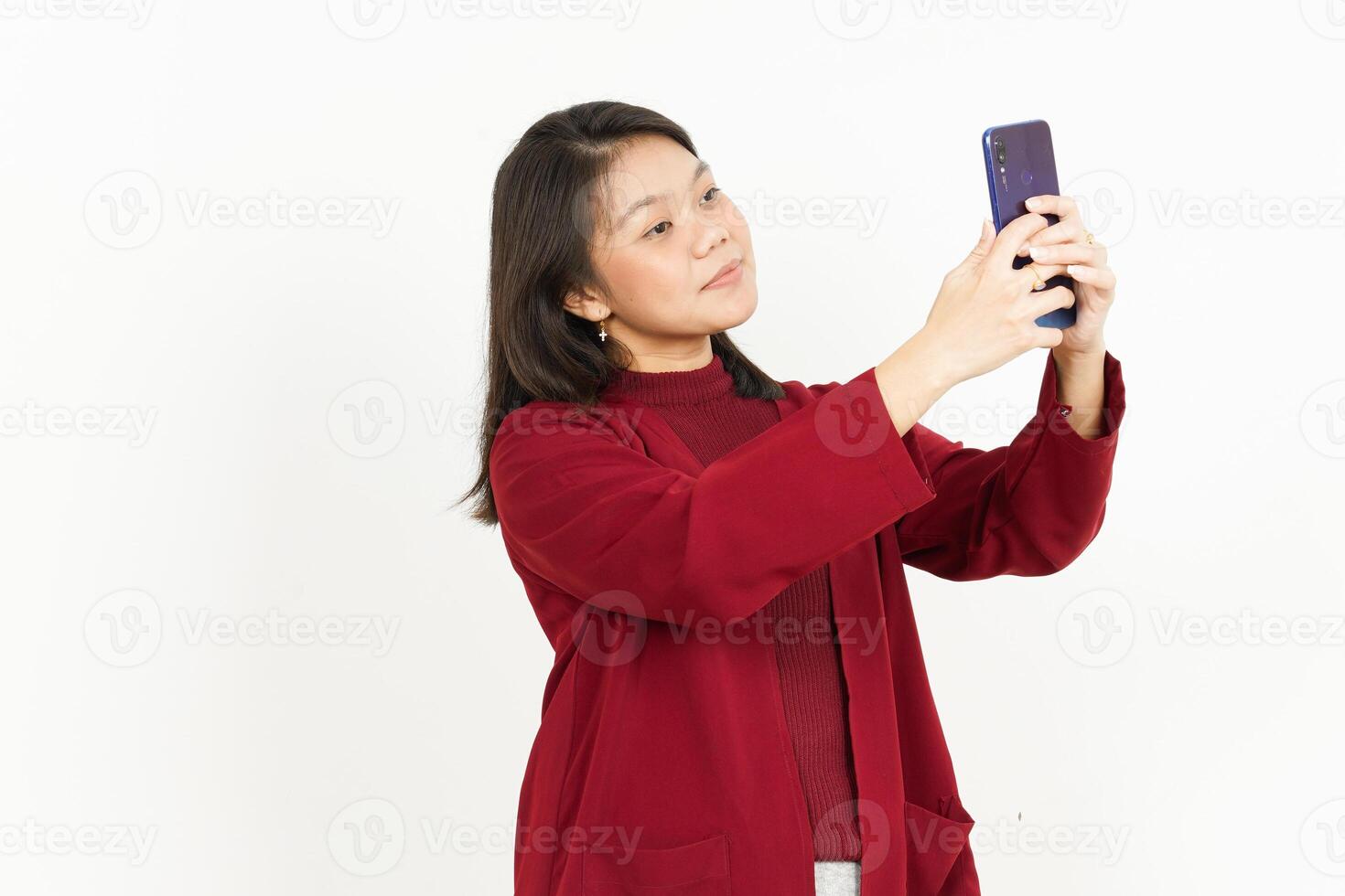 Holding and Using Smartphone Of Beautiful Asian Woman Wearing Red Shirt Isolated On White Background photo