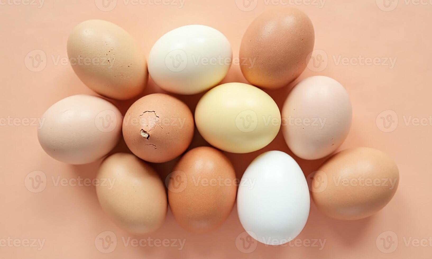 Assorted eggs Various colors and textures Peach background photo
