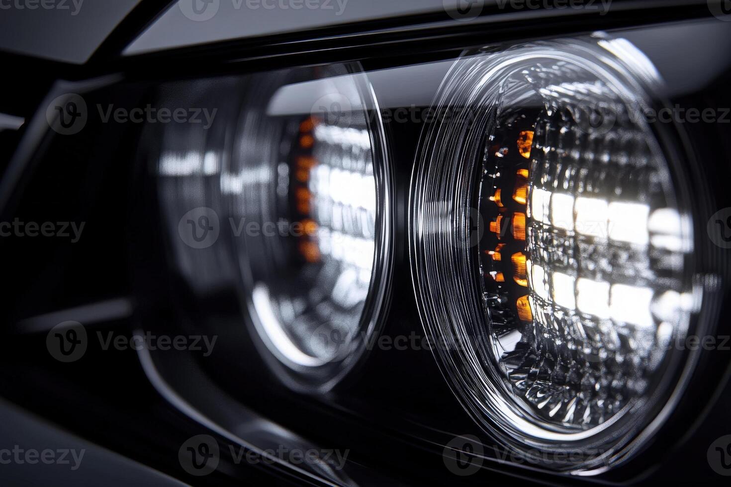 Bright car headlights showcase intricate patterns and advanced technology in a sleek, modern design. The illumination draws attention to the details and craftsmanship of the vehicle. photo