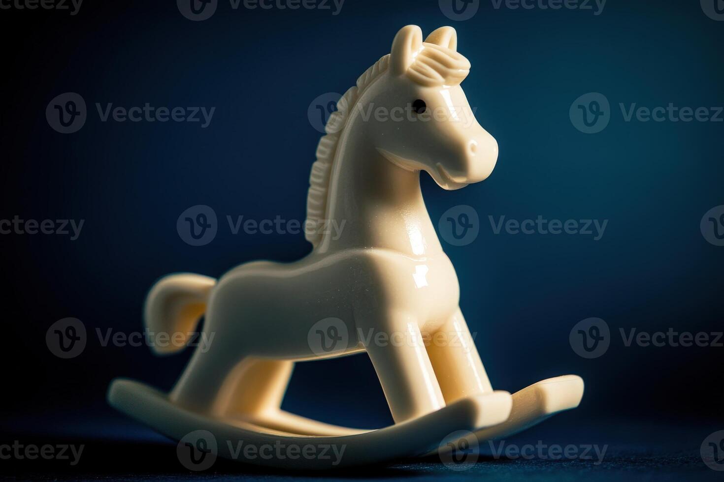 A carved, vintage rocking horse figurine sits on a curved base, illuminated by gentle light. The shape and texture highlight its nostalgic design, making it an appealing decorative piece. photo