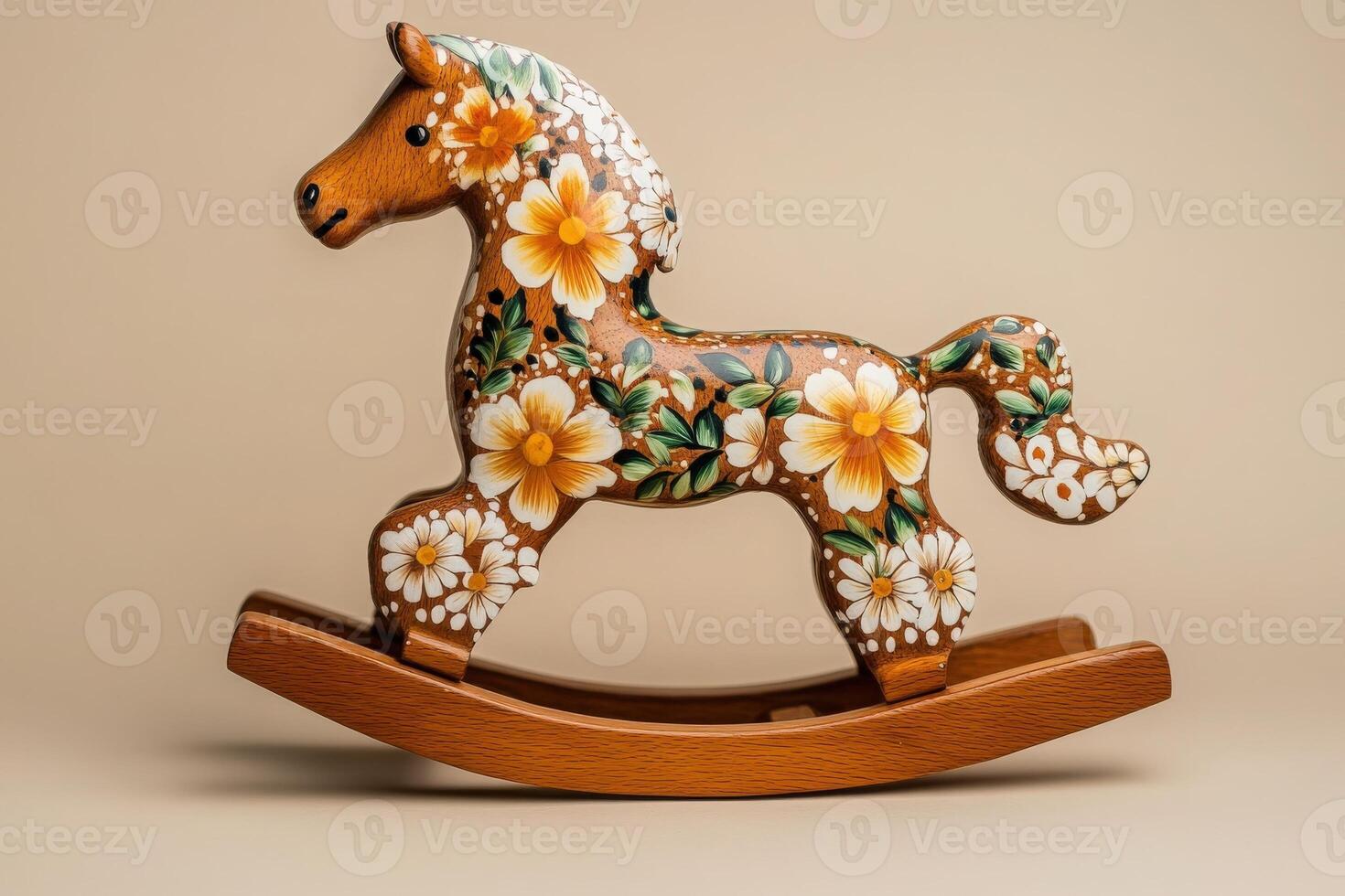 A beautifully crafted rocking horse features intricate floral designs in vibrant colors. The wooden toy stands out against a neutral backdrop, showcasing its artistic details and craftsmanship. photo