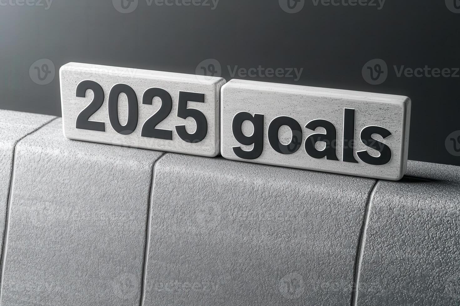 Two blocks display the text 2025 goals against a solid background, symbolizing the importance of planning and motivation for achieving future aspirations. photo
