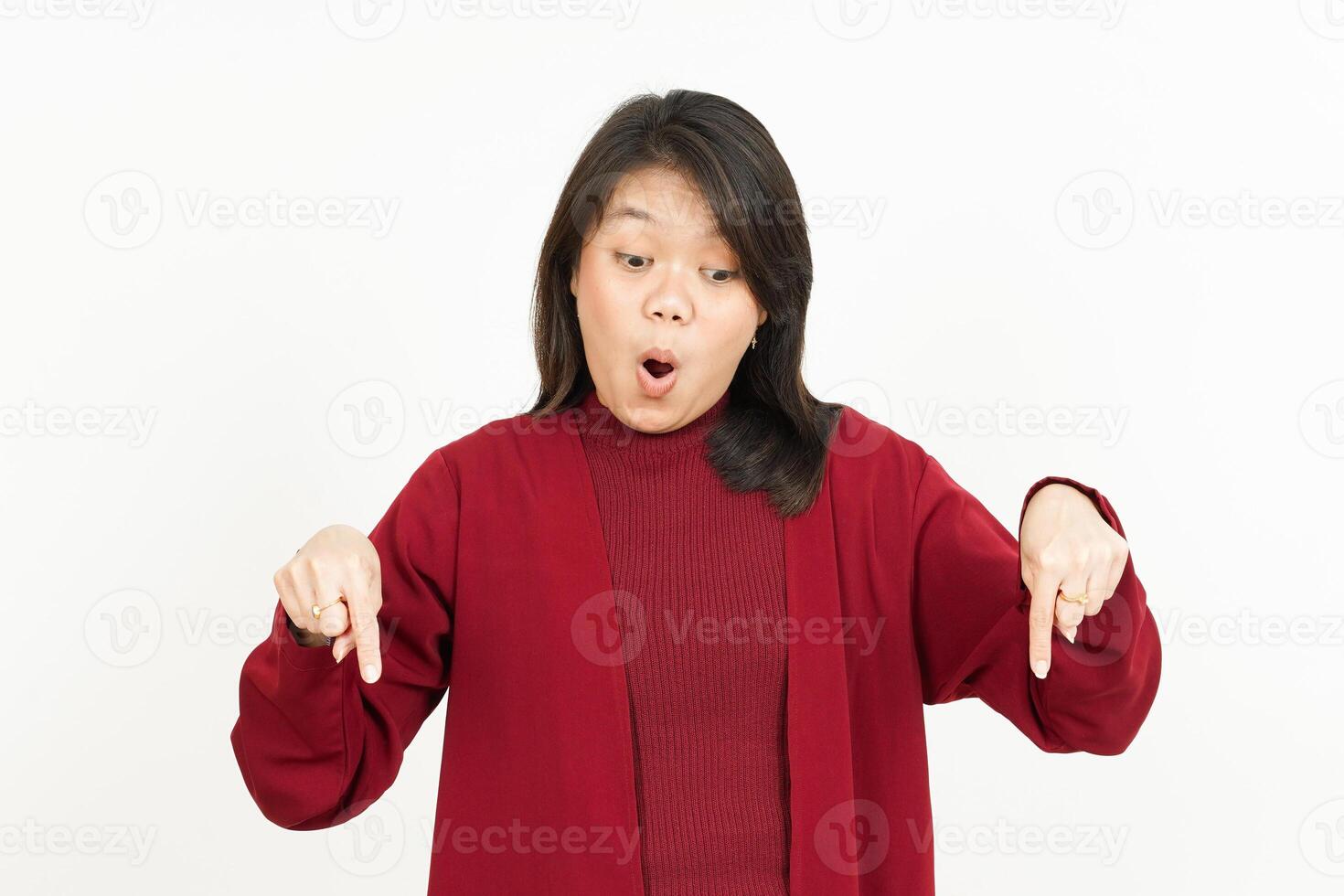 Pointing Down Of Beautiful Asian Woman Wearing Red Shirt Isolated On White Background photo