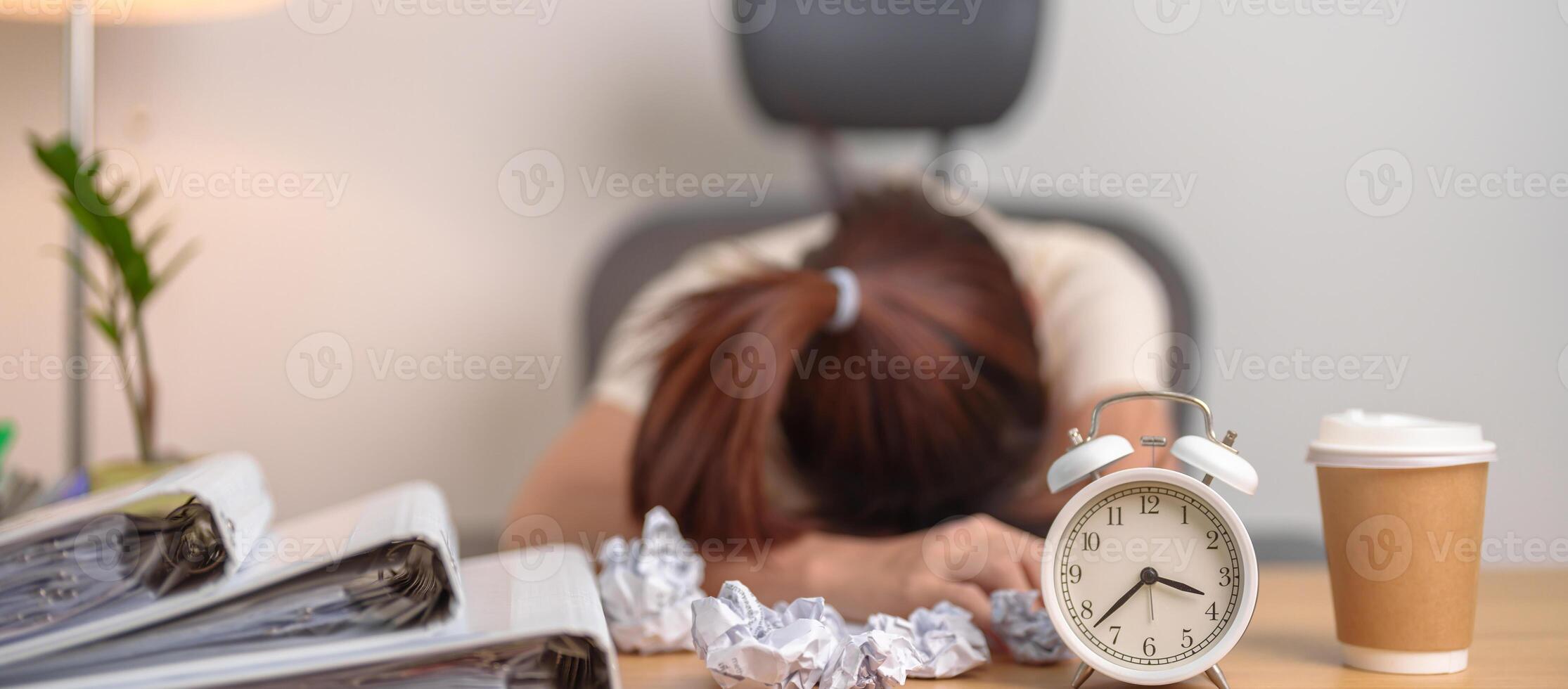 Stressed woman having Tired and Sleepy while working, female businesswoman having headache at office, Exhausted woman with documents folder stack and clock at home late night. Overworked and Overtime photo