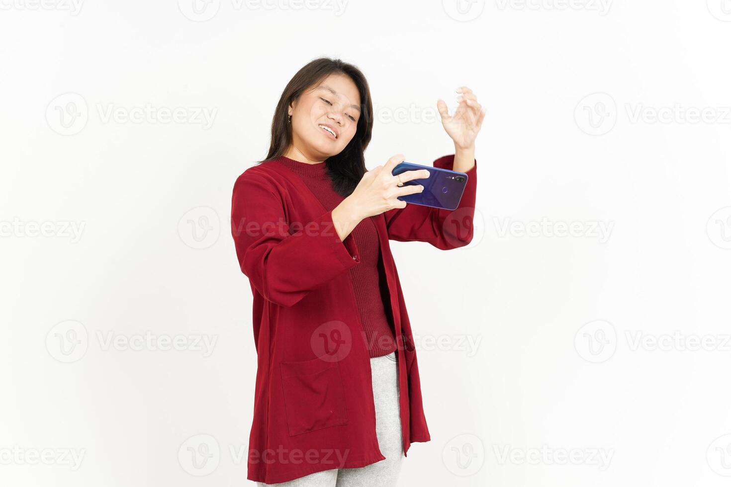Playing Mobile Game on Smartphone Of Beautiful Asian Woman Isolated On White Background photo