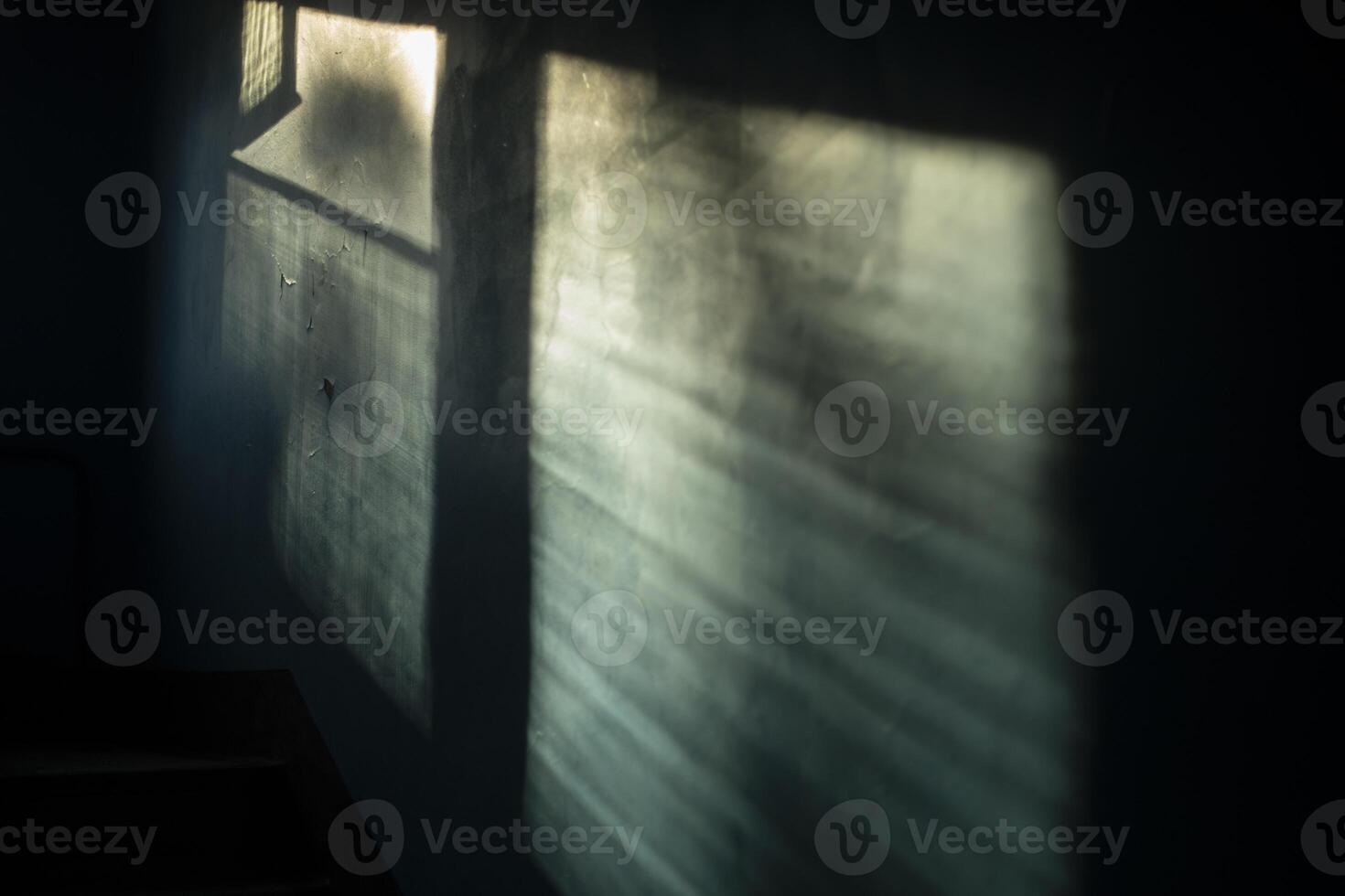 The light in the building. The rays of the sun on the wall. Window in the entrance. Interior of the building. photo