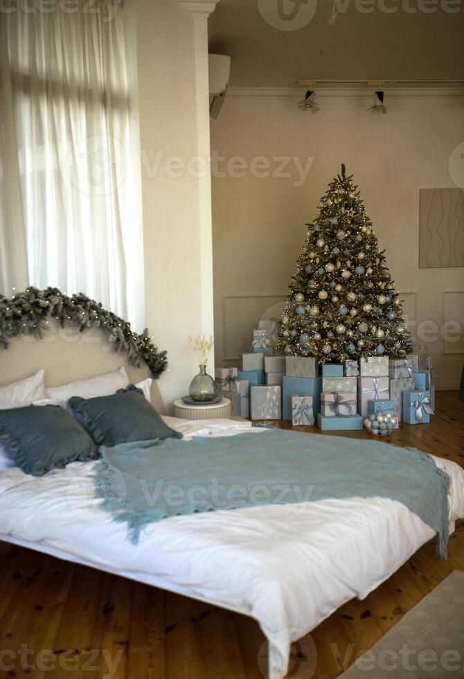 Christmas interior in the bedroom. bed and Christ. as tree photo