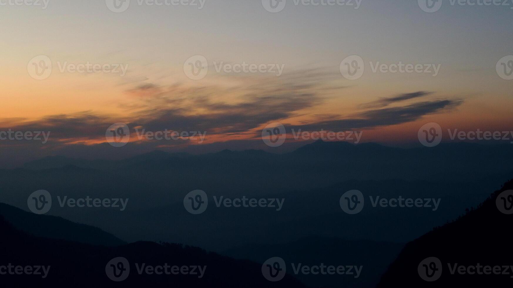 Misty Mountain Range Silhouette at Sunset in Malam Jabba, Pakistan photo