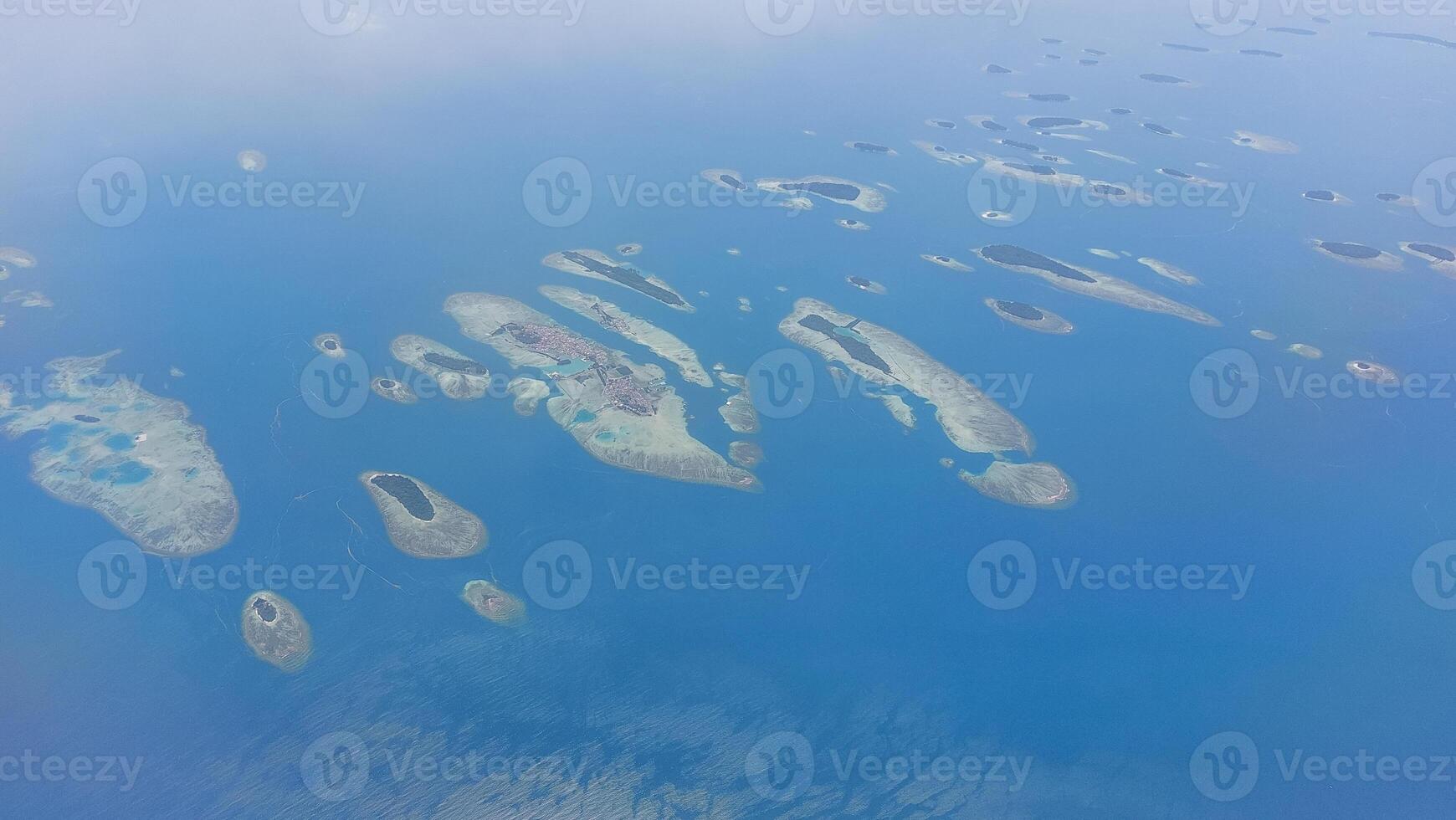 Aerial View of Indonesian island Archipelago and Clear Waters photo
