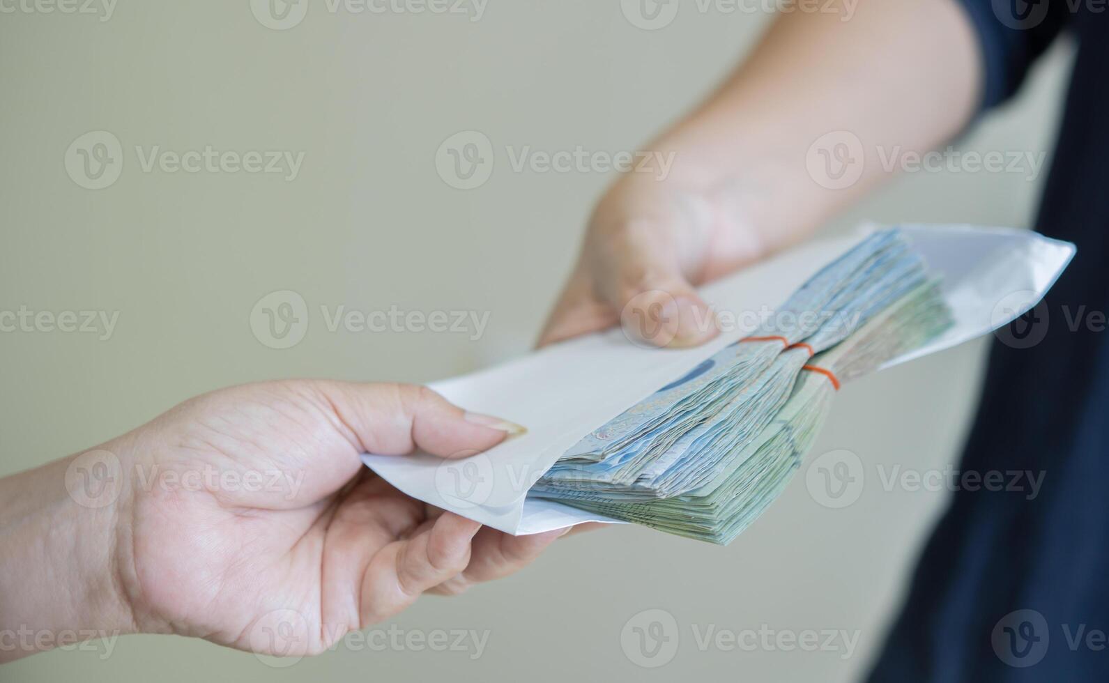 Business people making a contract with giving a bribery of money. photo