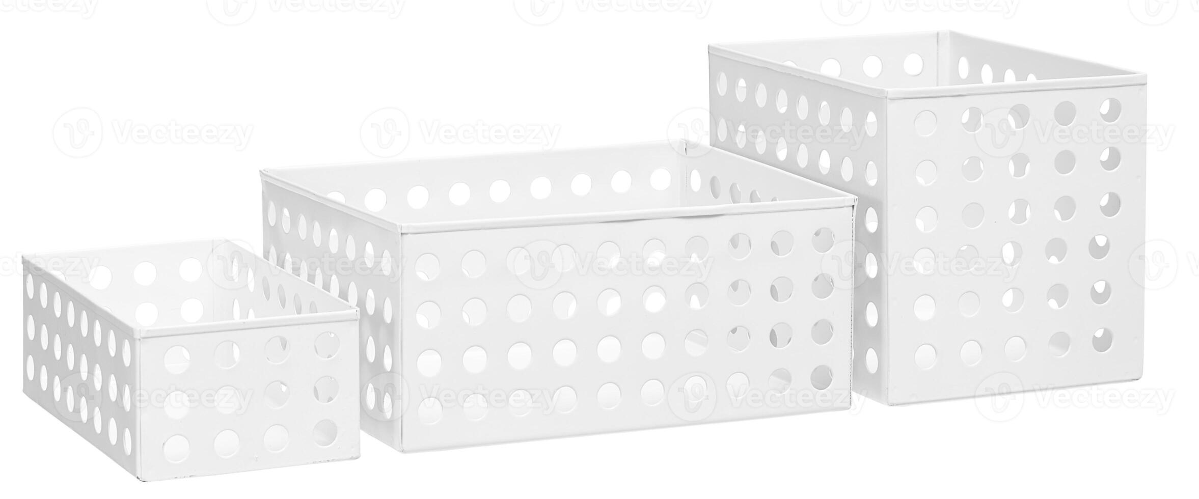 The storage basket has 3 round holes, small, medium, and large cut out isolated white background with clipping path photo