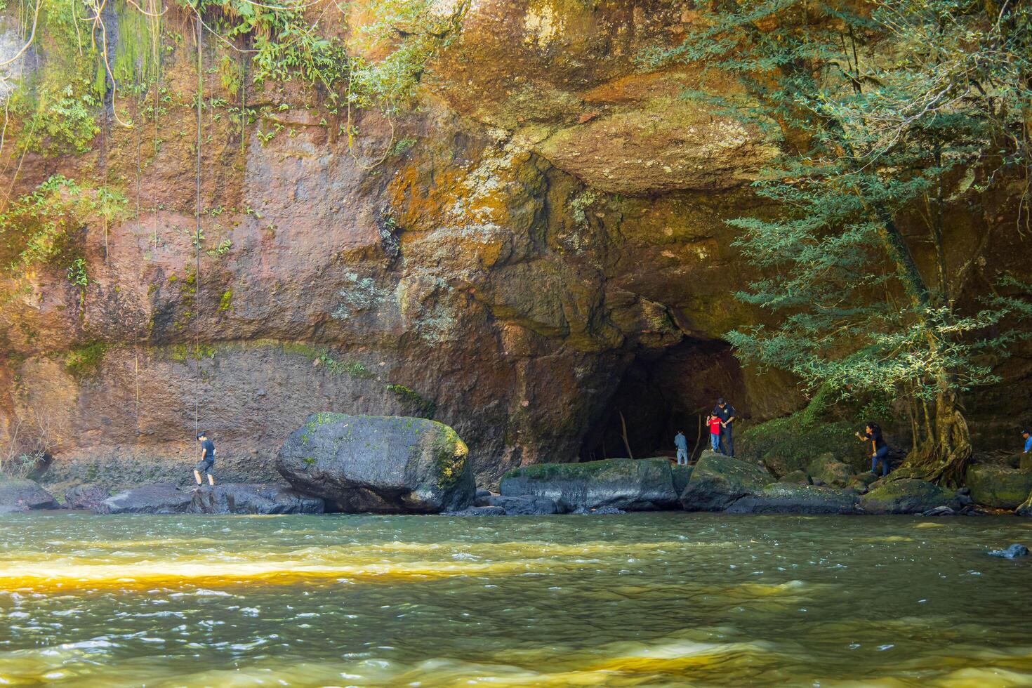Forest River with Cave and Rocky Landscaping. National park, Thailand. photo