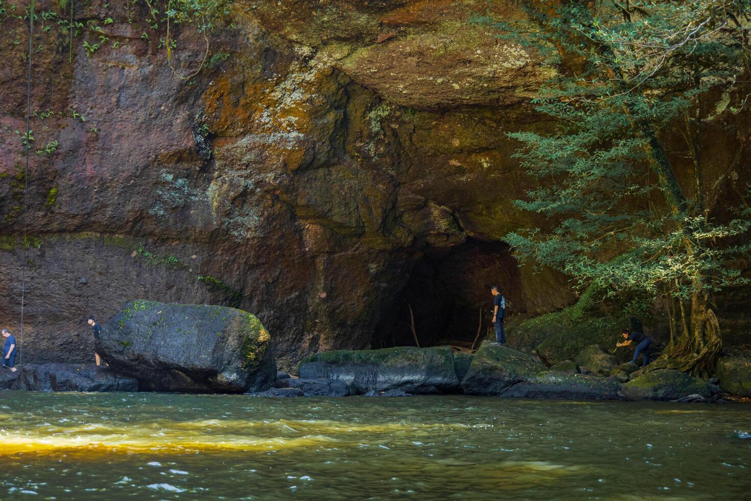 Forest River with Cave and Rocky Landscape. National park, Thailand. photo