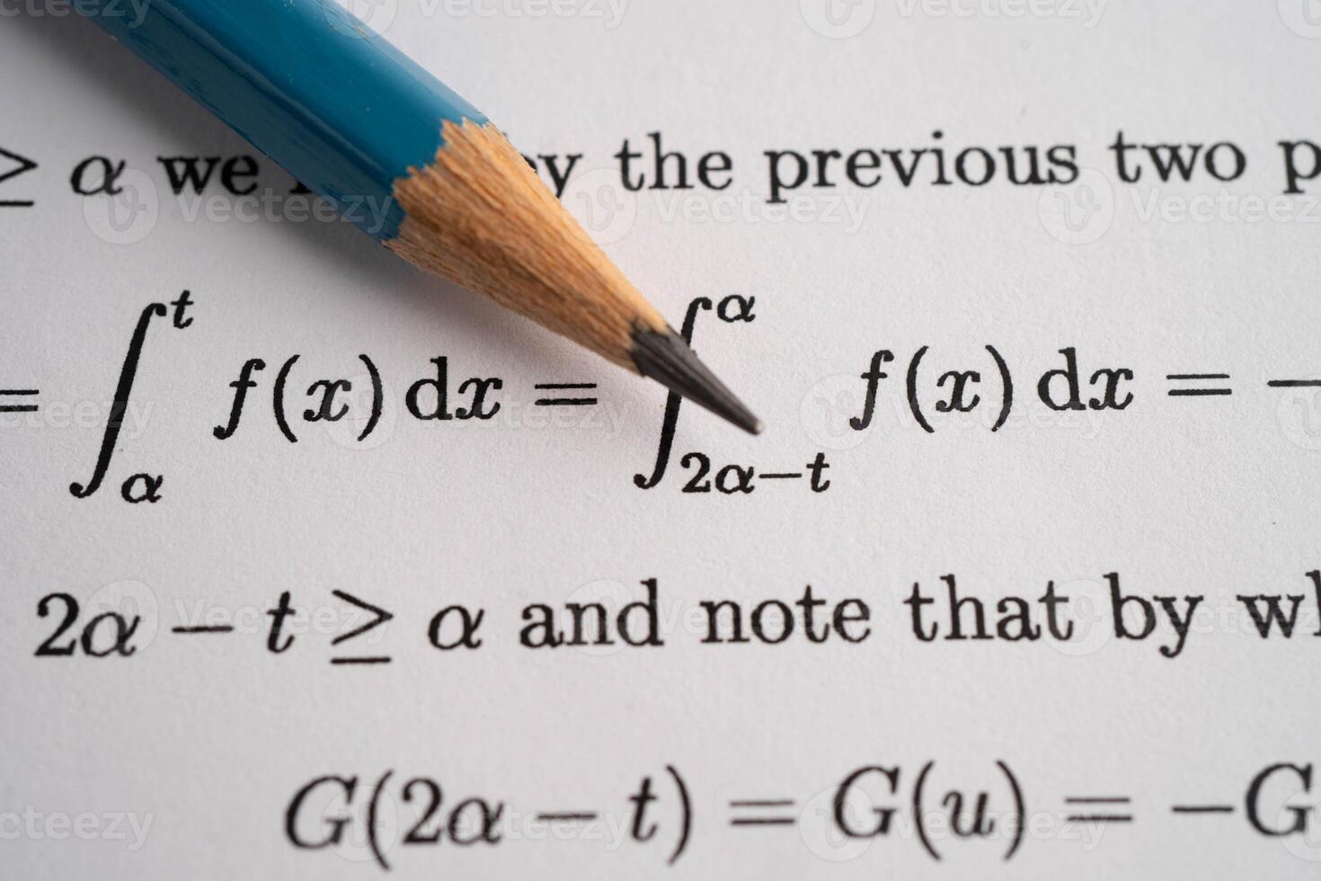 Pencil on mathematic formula exercise test paper in education school. photo