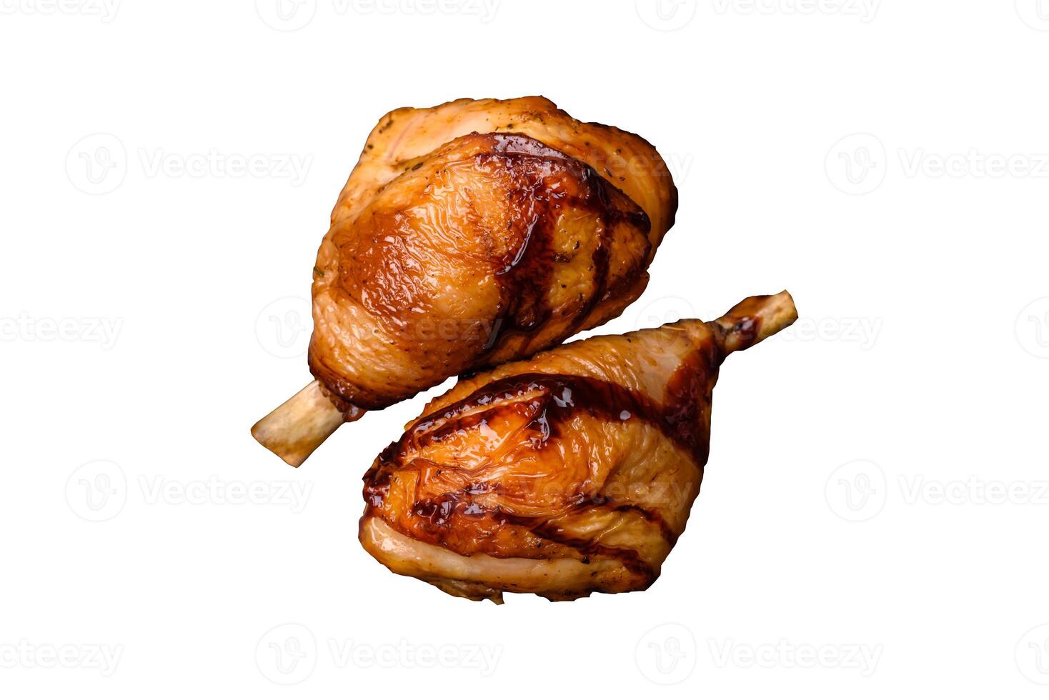 Delicious grilled chicken legs with spices and herbs in teriyaki sauce photo