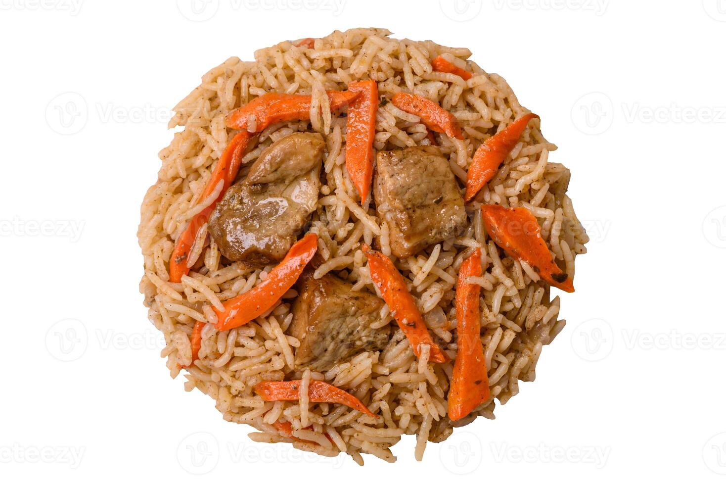 Delicious fresh pilaf with rice, carrots, meat, onions, spices and berries photo