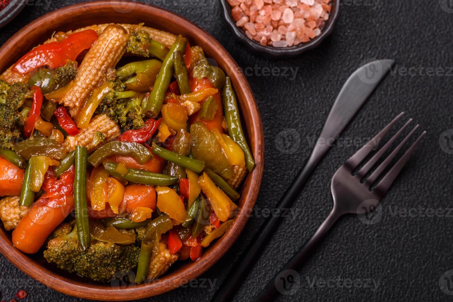 Mix of vegetables corn, carrots, peppers, broccoli, onions in teriyaki sauce photo