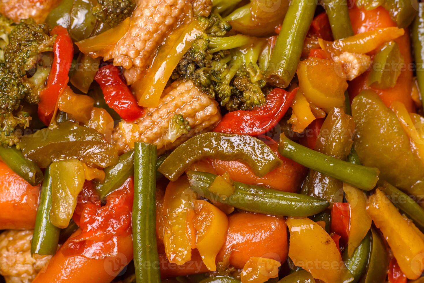 Mix of vegetables corn, carrots, peppers, broccoli, onions in teriyaki sauce photo