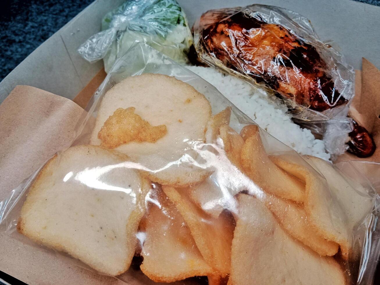 Nasi kotak is Indonesian rice box, consisting of rice photo