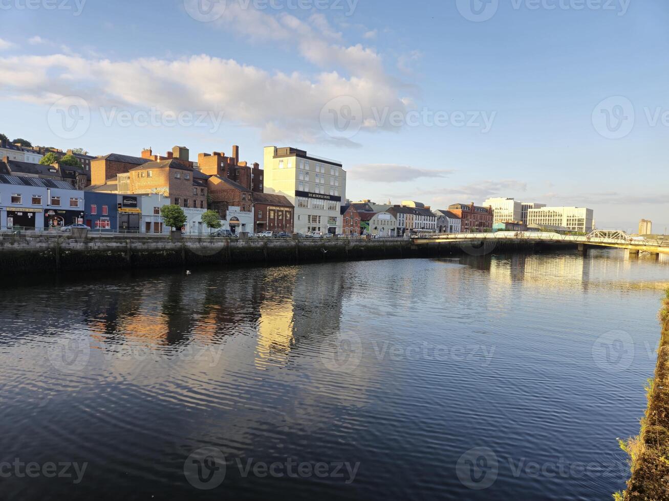 Waterfront Building with Azure Sky and Clouds at Dusk photo