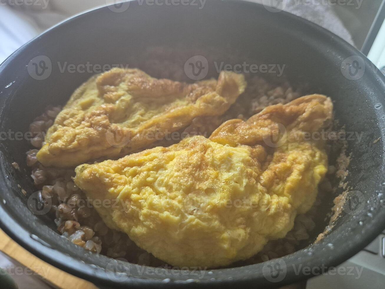 Fresh Ingredients for Cooking a Recipe in a Bowl with Cookware and Bakeware photo