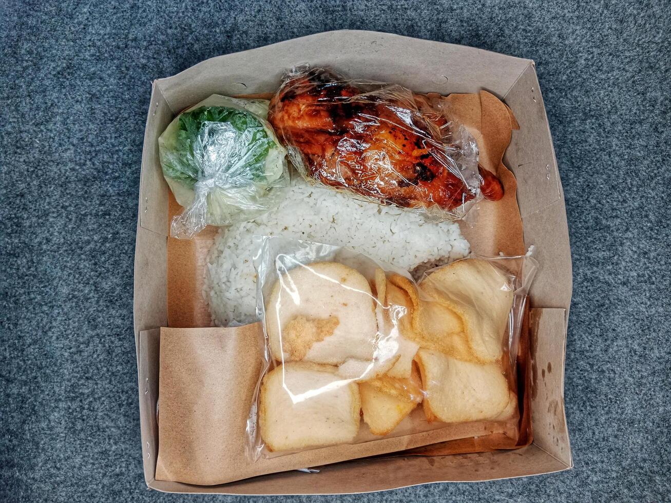Nasi kotak is a typical Indonesian box of rice at cultural events. photo