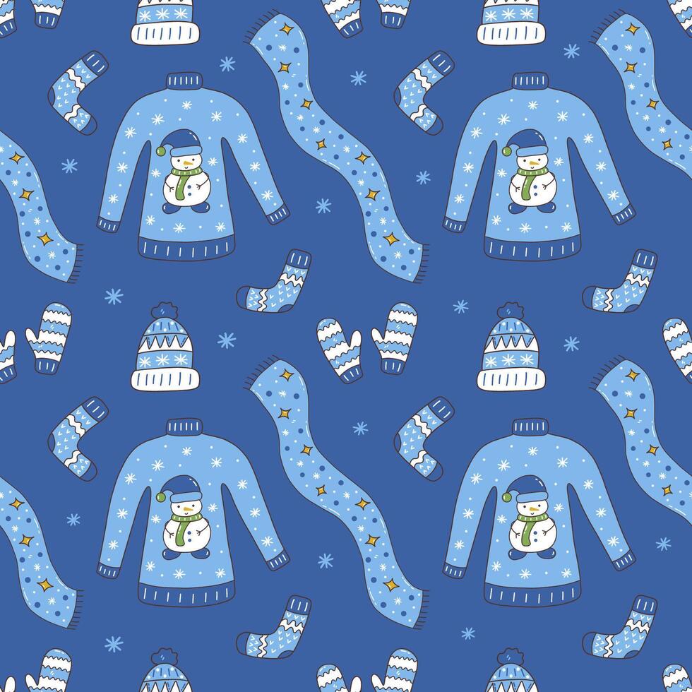 Seamless pattern with winter clothes on blue background vector
