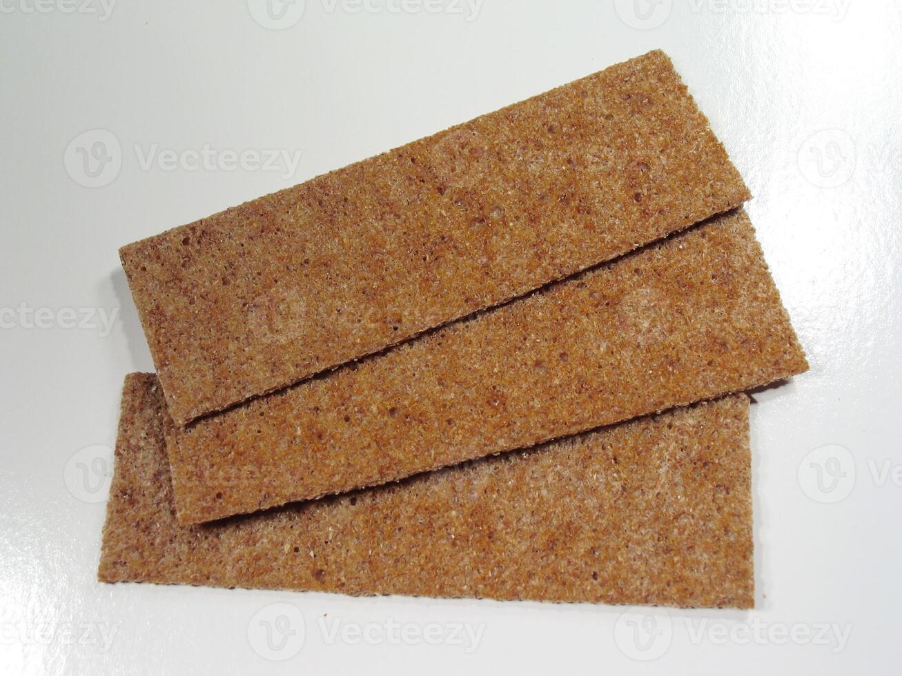 Sanding Block and Triangle Wooden Accessories on Beige Flooring photo