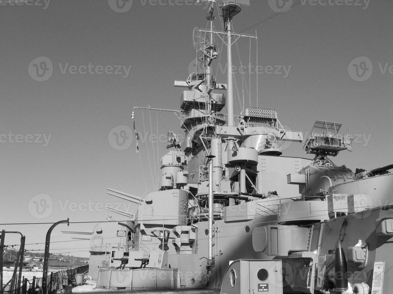 Navy Battle Ship With Guns and Other Weapons Background photo