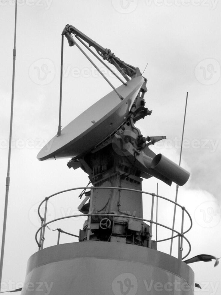 Navy Battle Ship With Guns and Other Weapons Background photo