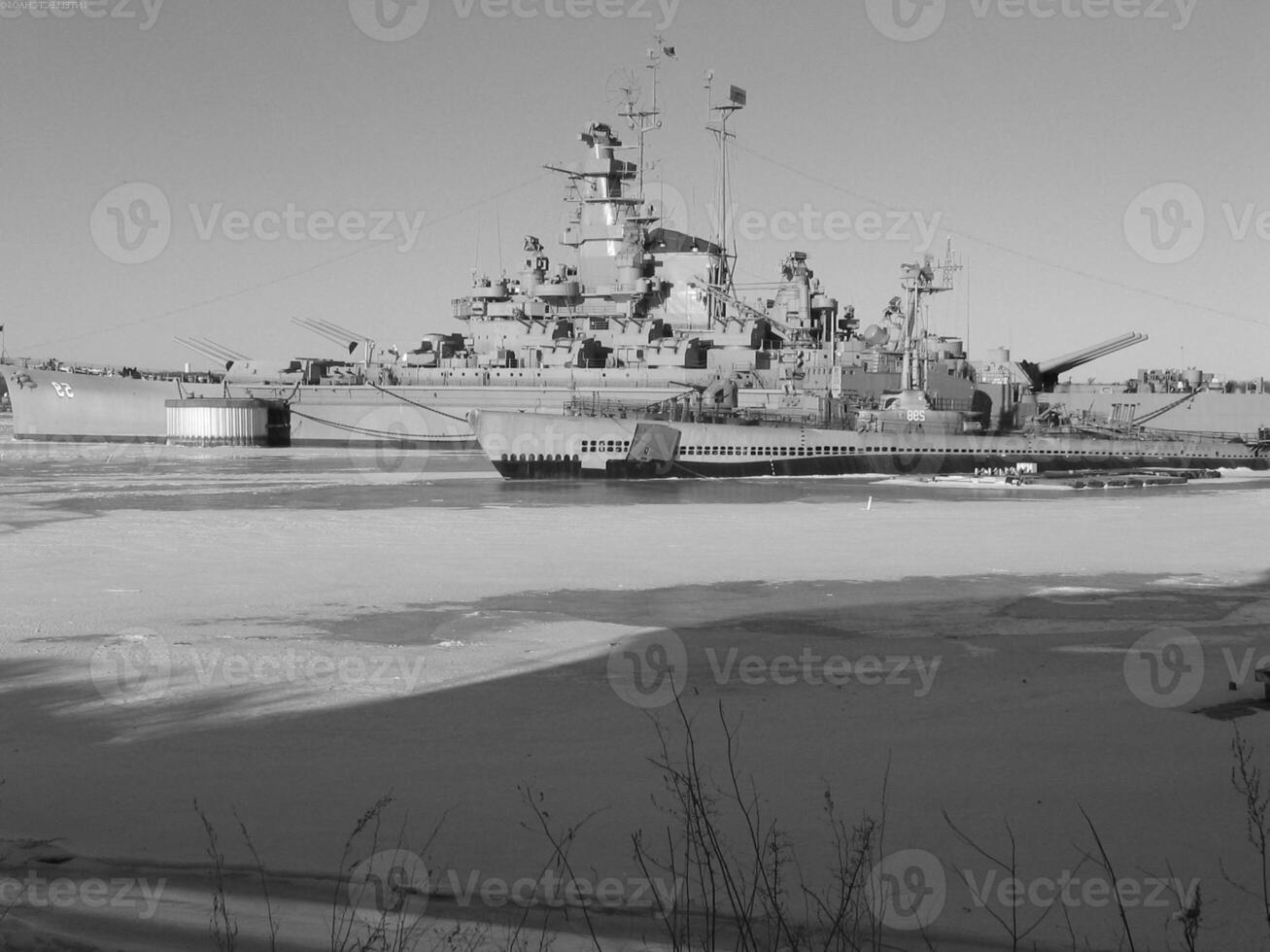 Navy Battle Ship With Guns and Other Weapons Background photo