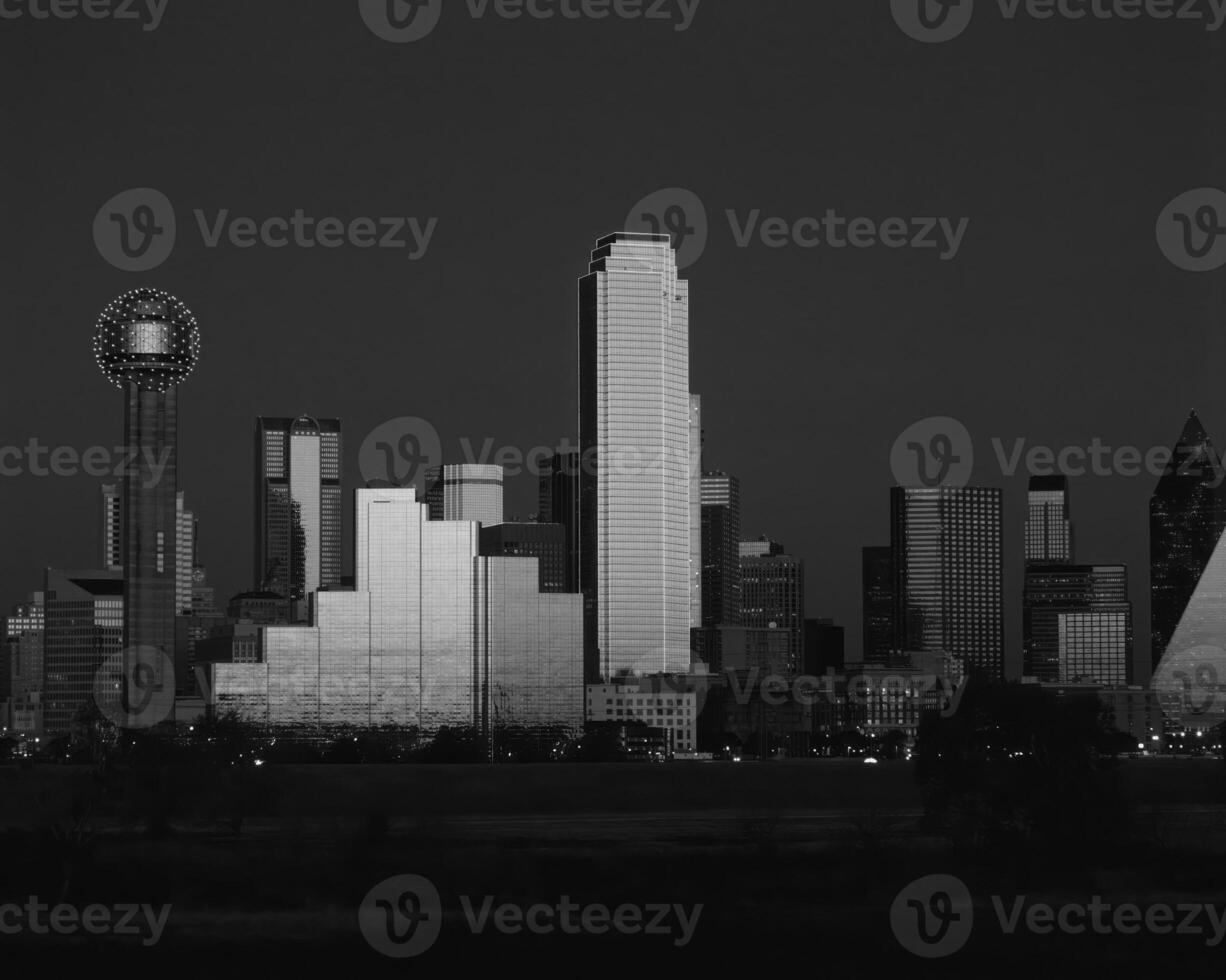 Dusk Cityscape Skyscrapers and Tower Blocks Under a Cloudy Sky photo
