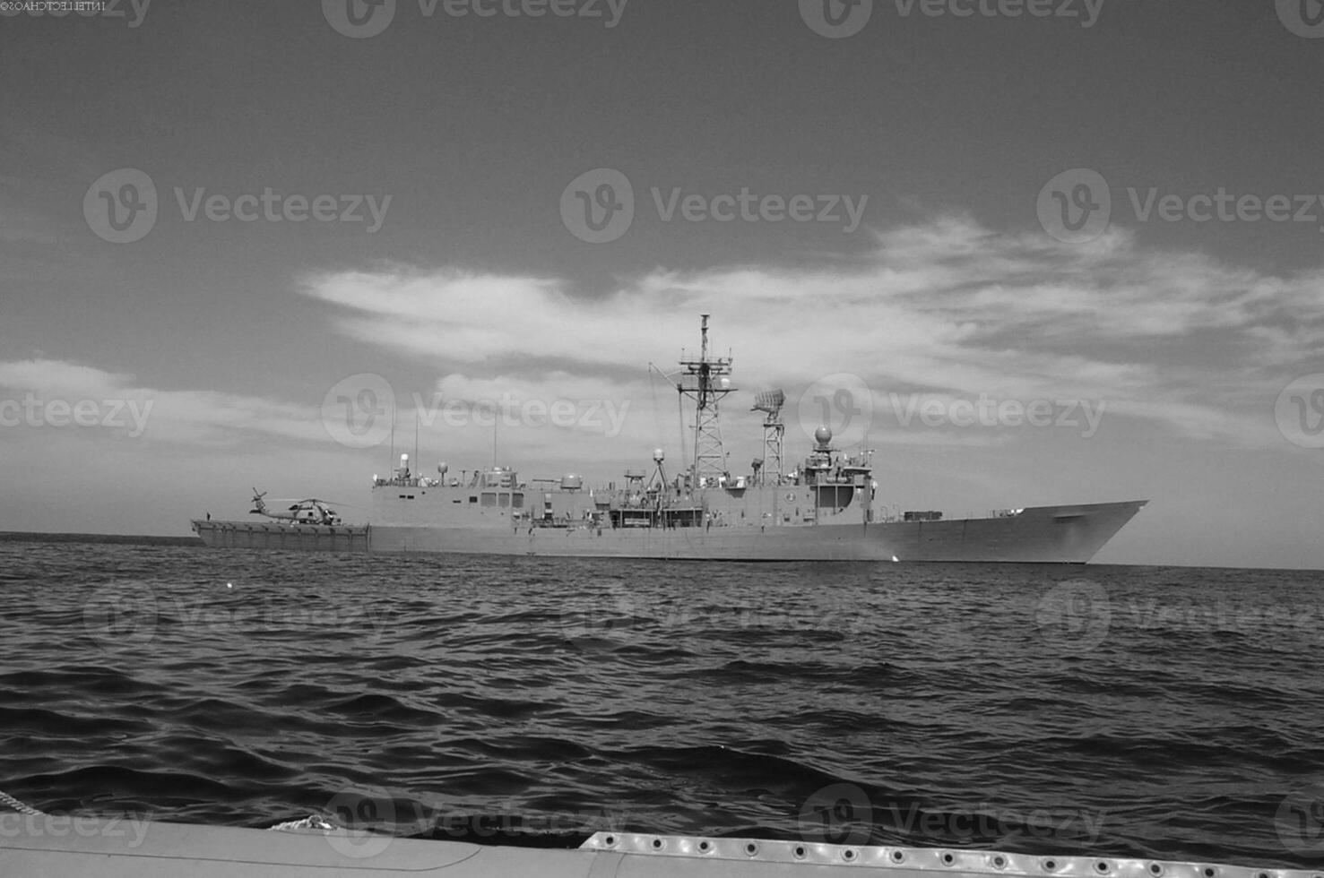 Navy Battle Ship With Guns and Other Weapons Background photo