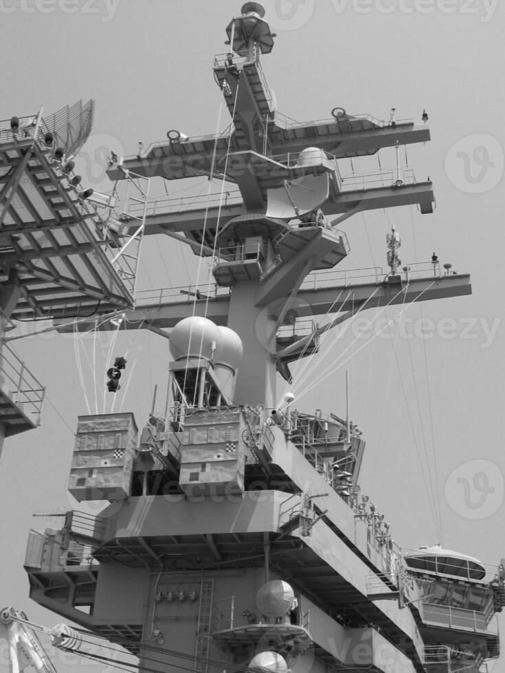 Navy Battle Ship With Guns and Other Weapons Background photo