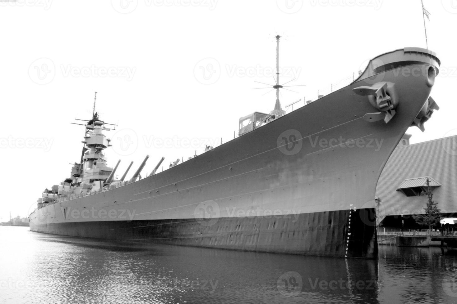 Navy Battle Ship With Guns and Other Weapons Background photo