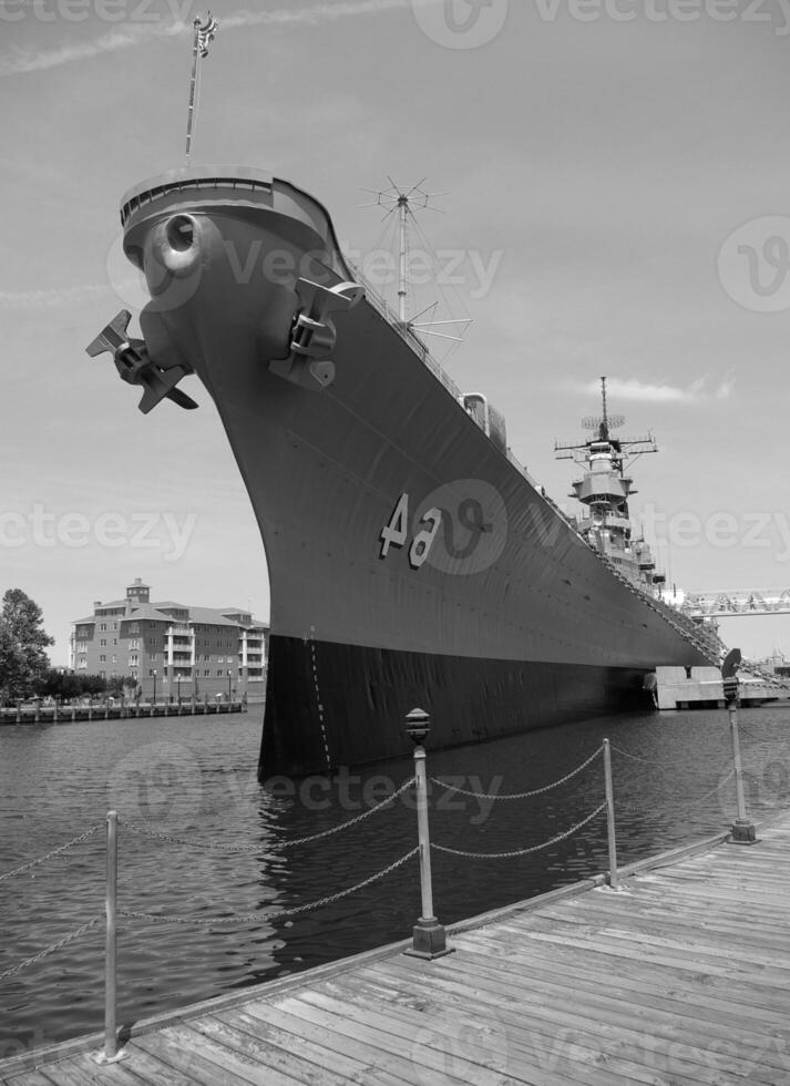 Navy Battle Ship With Guns and Other Weapons Background photo