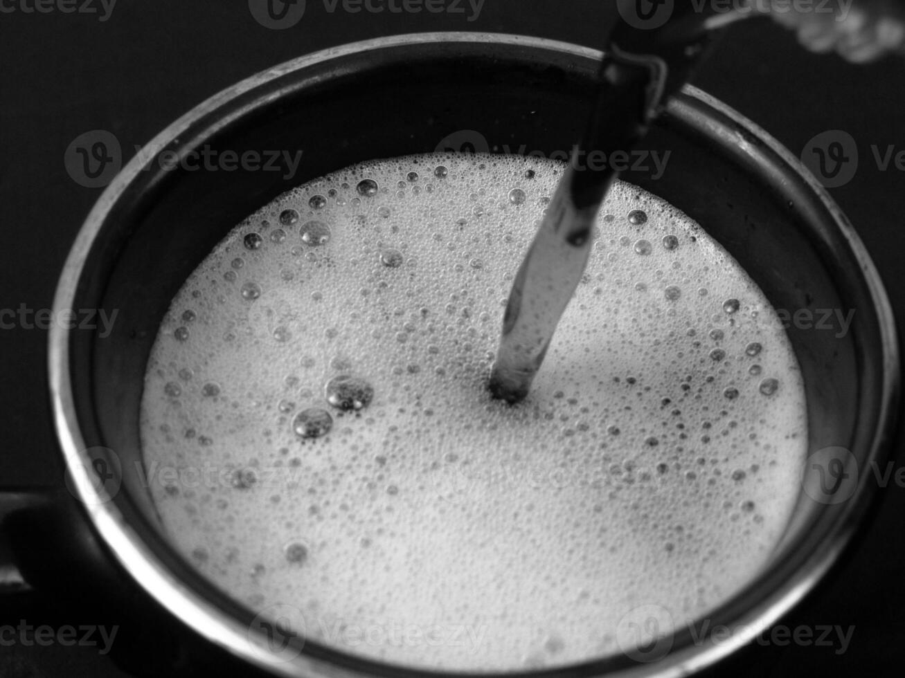 Cup of Liquid Ingredient in Kitchen Utensil Setting photo