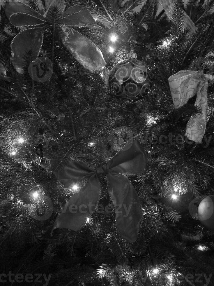 Christmas Tree with Gold Ornaments on Evergreen Branches photo