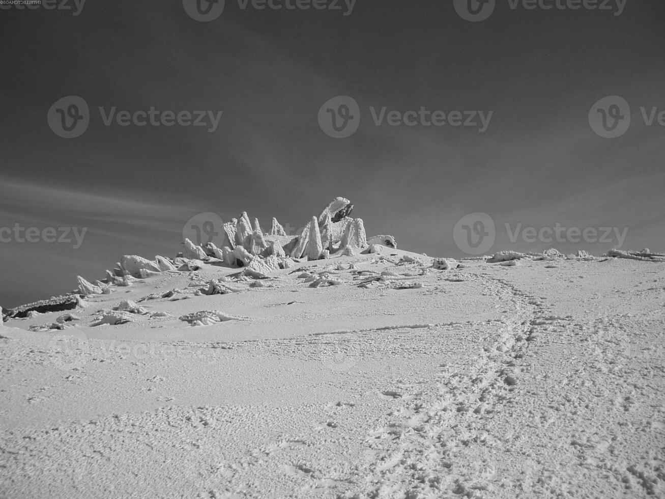 Mountain Landscape with Snow, Ice Cap, and Cloudy Sky photo