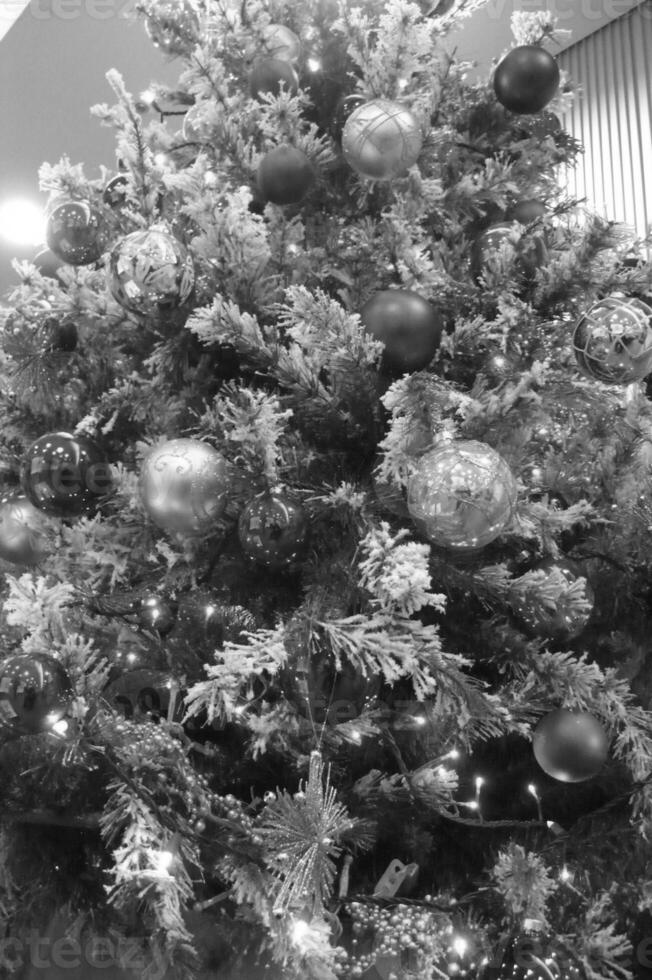 Christmas Tree with Ornaments and Evergreen Branches photo