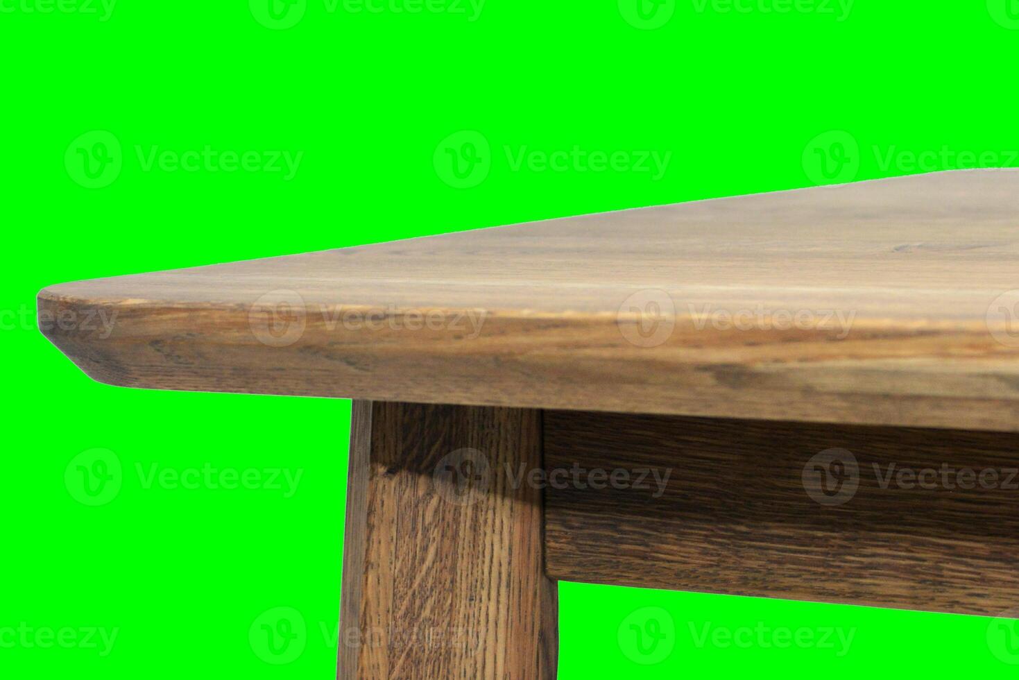 Wooden dinner table surface. Natural wood furniture close view. Table isolated over green screen chroma key background photo
