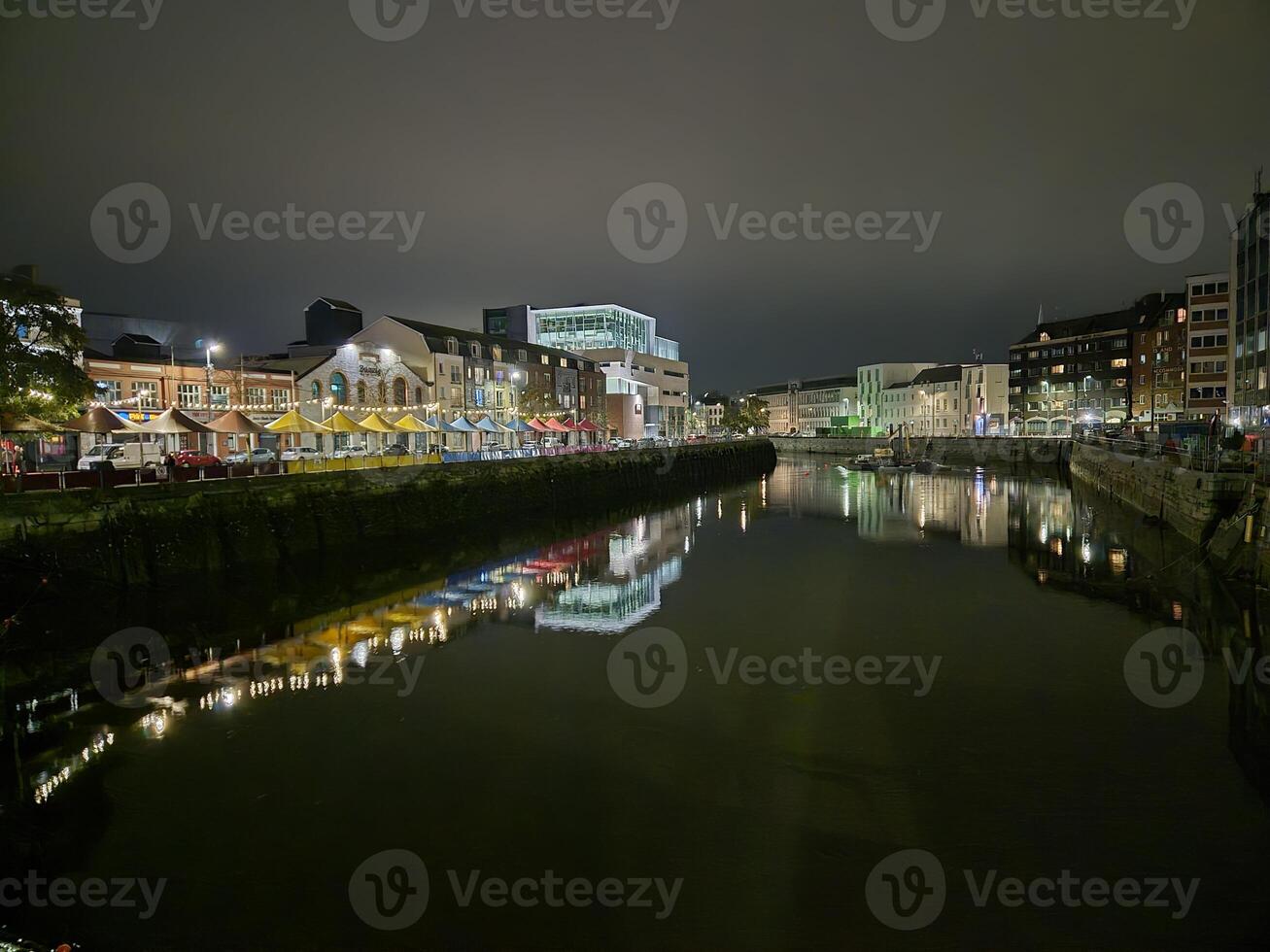 Urban Building Reflected in Lake with Sky and Cityscape photo