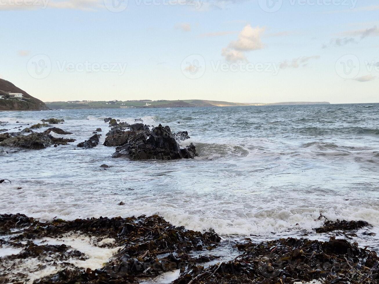 Coastal Landscape with Water and Sky at Horizon photo
