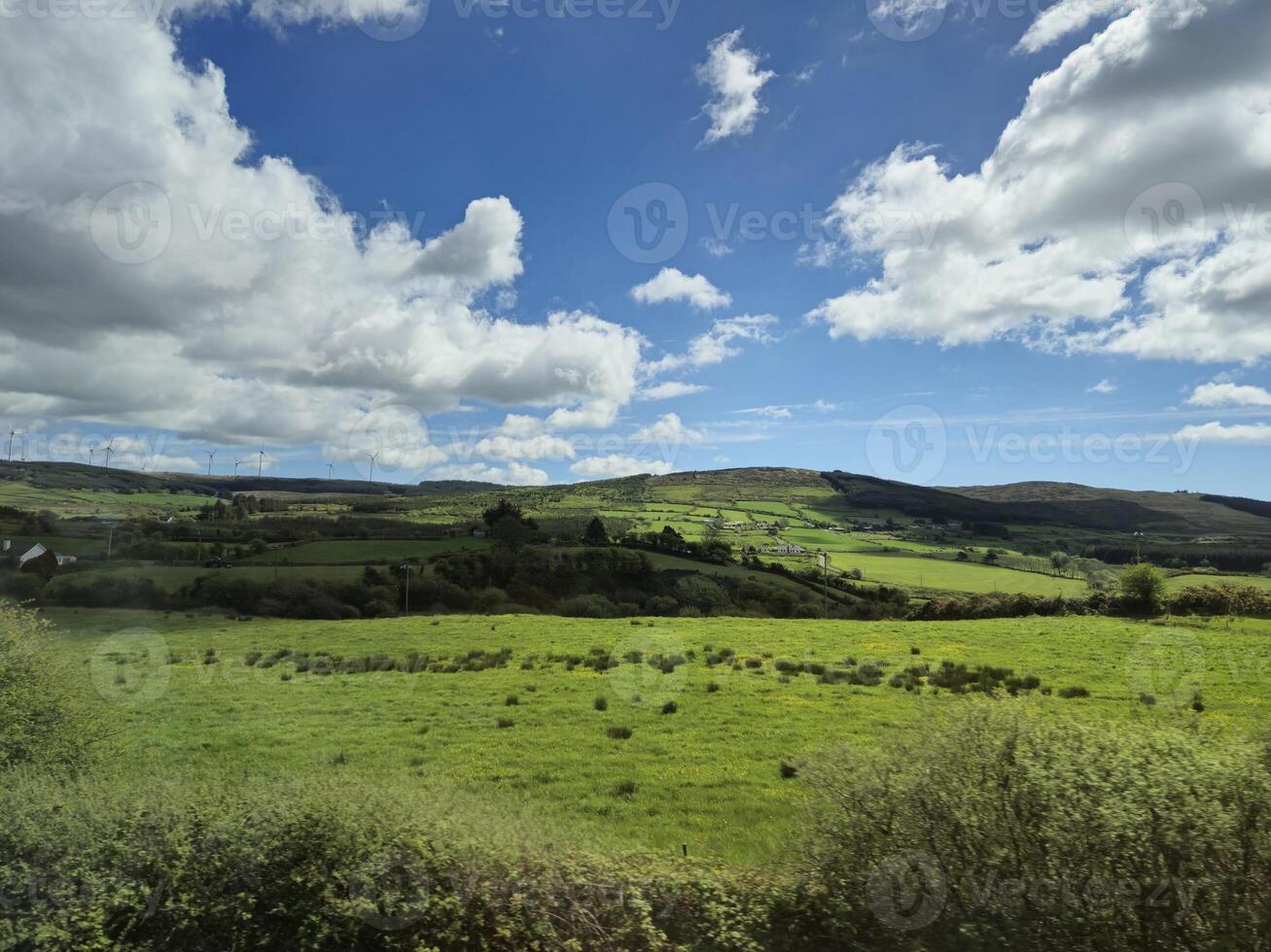 Mountainous Natural Landscape with Cumulus Clouds and Plant Community photo