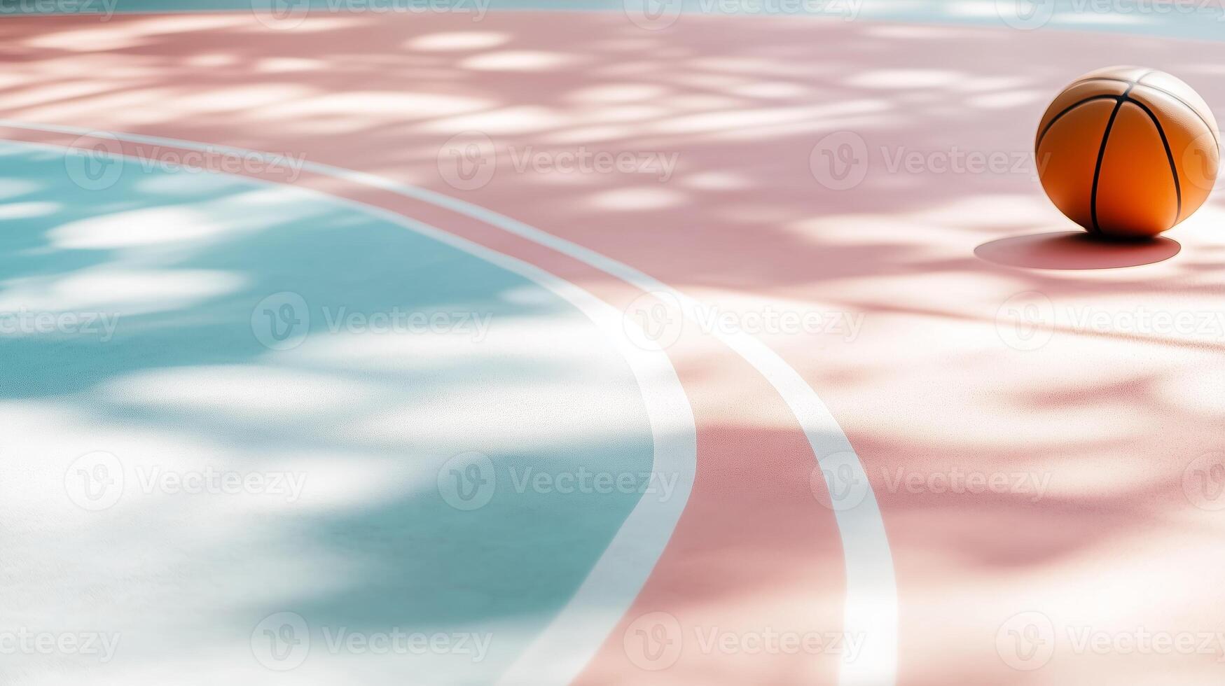 Bright sunny basketball court with a single ball resting on the vibrant surface photo