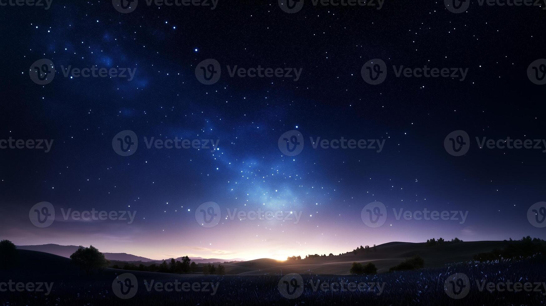 Starry night sky over rolling hills near a distant horizon during twilight hours photo